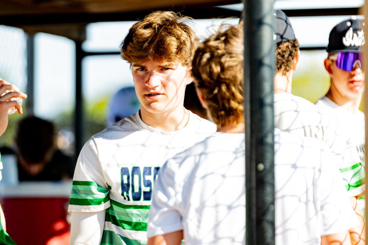 In the dugout with teammates